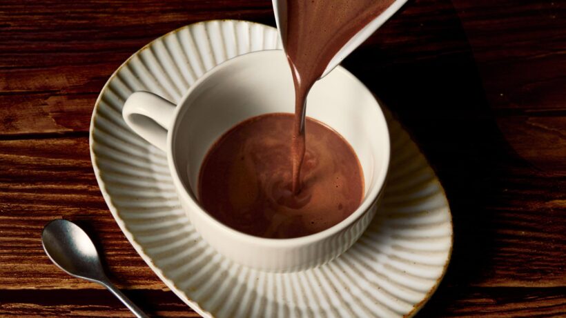 Pouring hot chocolate into a mug