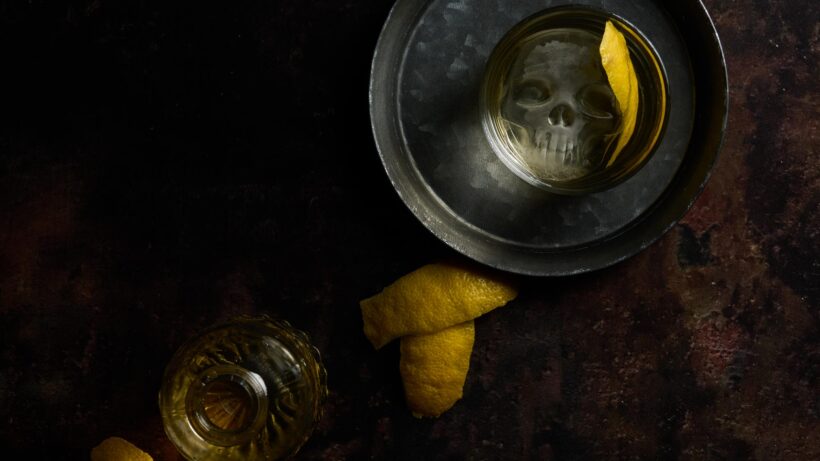 Oaxaca Old Fashioned with lemon peel and skull shaped ice