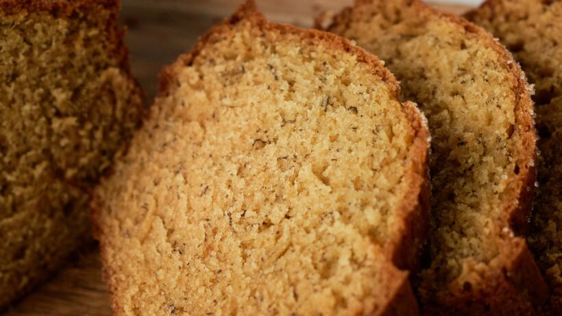 Zoomed in image of the tender crumb in a slice of banana bread.