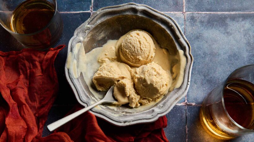 Three scoops of browned butter bourbon ice cream in a metal bowl.