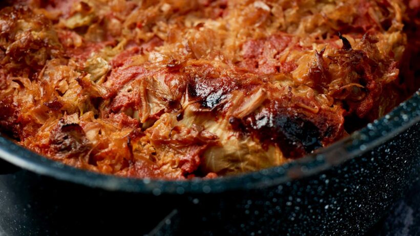 Stuffed cabbage in a roasting pan.