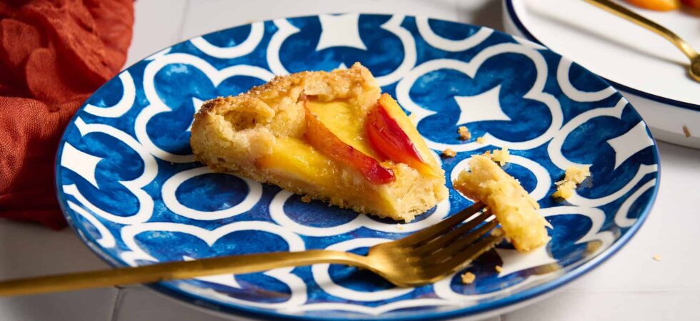 Slice of nectarine and frangipane galette.