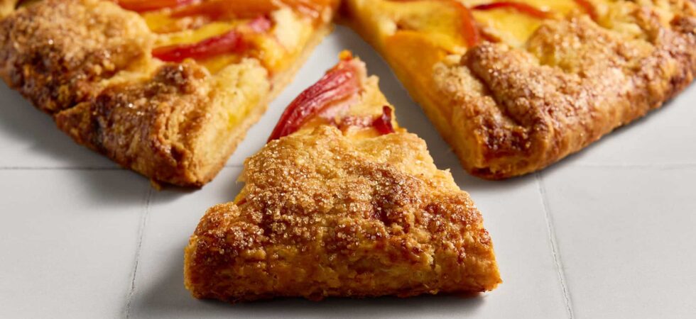 A slice of nectarine and frangipane galette.