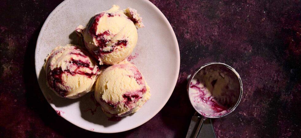 sweetcorn ice cream with blackberry swirl scoops.
