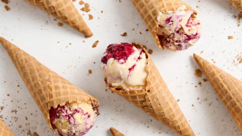 Rows Sweet Corn Ice Cream with a blackbery swirl ice cream cones.