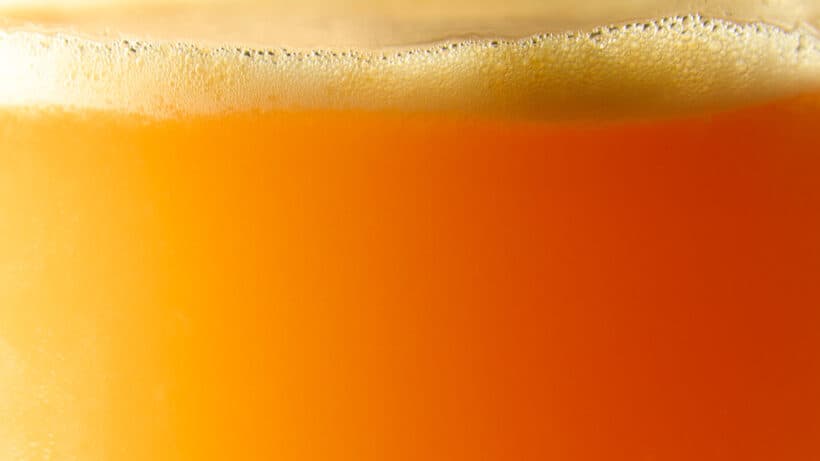 zoomed in image of the liquid and foam in a Pineapple Passionfruit Margarita