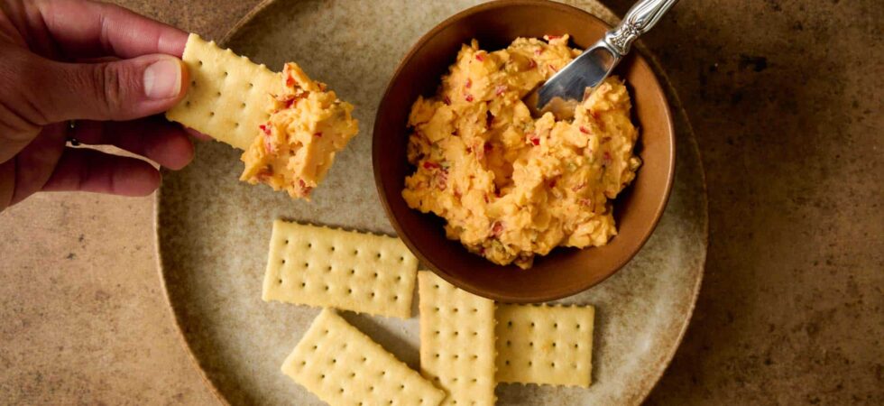 Pimento cheese recipe with cream cheese spread on a cracker