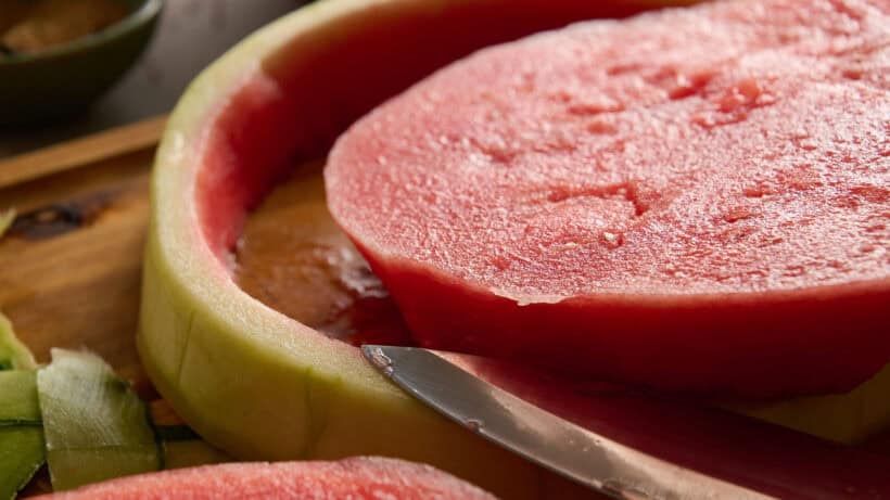 slicing watermelon for Tajín pickled watermelon rinds